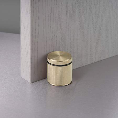 Buster + Punch Linear Knurled 2-5/8 Inch Freestanding Peg Door Stop Brass