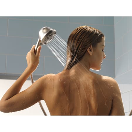 Delta-52625-PK-Handshower in Use in Brilliance Stainless