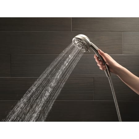 Delta-54435-PK-Handshower in Use in Brilliance Stainless