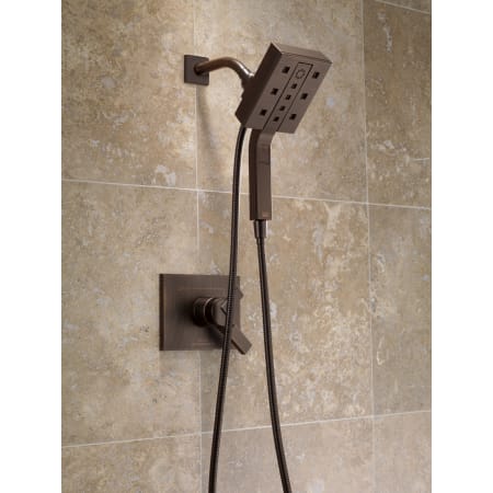 Delta-58470-Installed Shower Head and Handshower Trim in Venetian Bronze