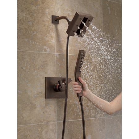 Delta-58470-Running Shower Head and Handshower in Venetian Bronze