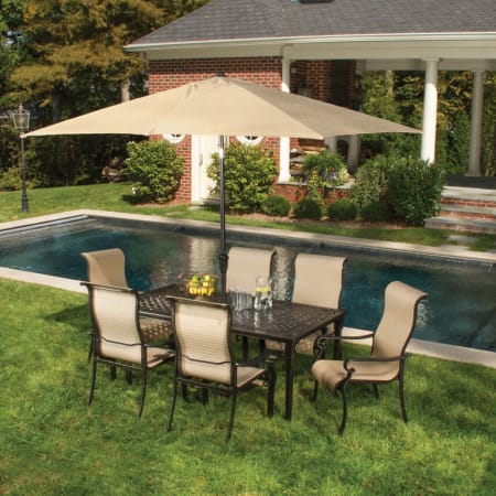 Hanover Brigantine 7-Piece Aluminum Framed Outdoor Dining Set with Rectangular Aluminum Tabletop, Umbrella, and Textiline Arm Chairs Bronze / Harvest Wheat