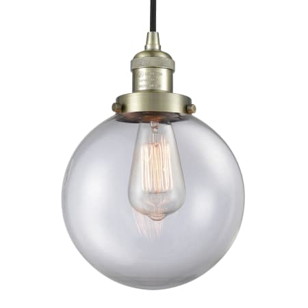 Innovations Lighting Beacon Single Light 8" Wide Mini Pendant with Adjustable Cord Antique Brass / Clear