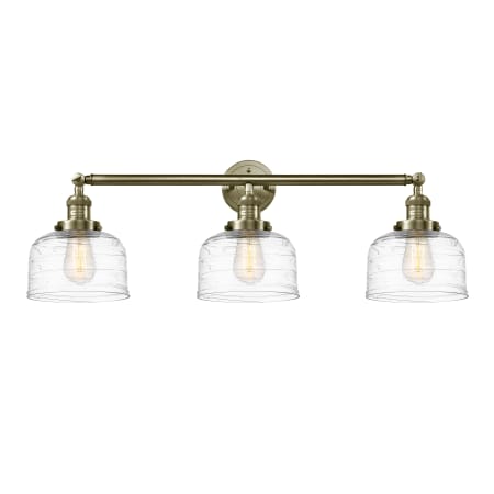 Innovations Lighting Bell 3 Light 32" Wide Vanity Light Antique Brass / Clear Deco Swirl