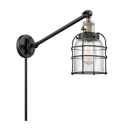 Innovations Lighting Small Bell Cage Single Light 25" Tall Bathroom Sconce Black Antique Brass / Clear