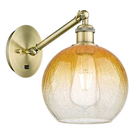 Innovations Lighting Brookhaven Globe 11" Tall Wall Sconce Antique Brass / Amber