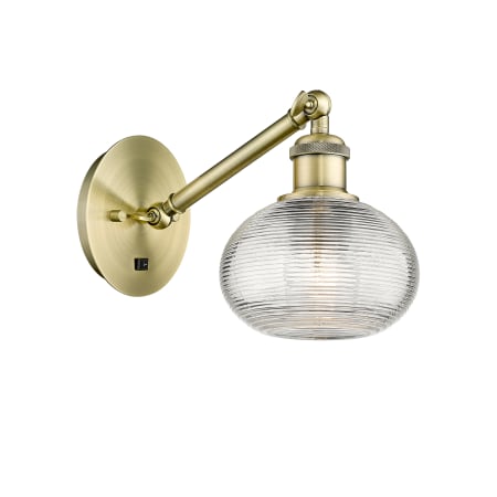 Innovations Lighting Ithaca 7" Tall Wall Sconce Antique Brass / Clear Ithaca