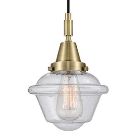 Innovations Lighting Oxford 7" Wide Mini Pendant with Clear, Seedy Glass Shade Antique Brass