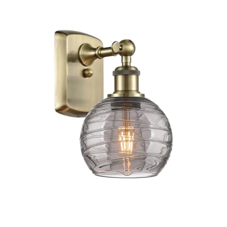 Innovations Lighting Athens Deco Swirl 10" Tall Wall Sconce Antique Brass / Light Smoke Deco Swirl