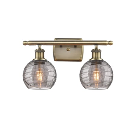 Innovations Lighting Athens Deco Swirl 2 Light 16" Wide Vanity Light Antique Brass / Light Smoke Deco Swirl