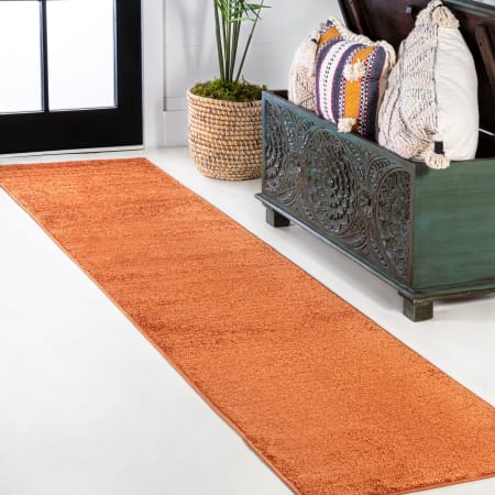JONATHAN Y Lighting Supersoft 2' x 8' Polypropylene Solid Rectangle Area Rug Orange