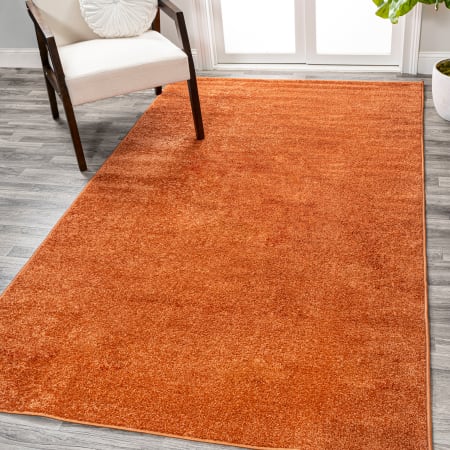 JONATHAN Y Lighting Supersoft 5' x 8' Polypropylene Solid Indoor Area Rug Orange