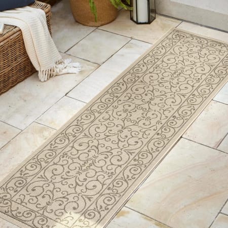 JONATHAN Y Lighting Santa Monica 2-1/4' x 8' Polypropylene Border Indoor/Outdoor Runner Beige / Brown