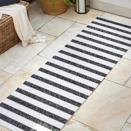 JONATHAN Y Lighting Santa Monica 2-1/4' x 8' Polypropylene Striped Indoor / Outdoor Rectangle Area Rug Black / Cream