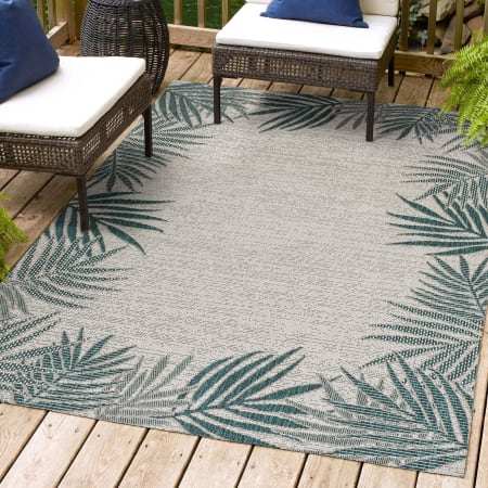 JONATHAN Y Lighting Tuscan Sun 7-3/4' x 10' Border, Palm Tree, and Traditional Indoor/Outdoor Rectangular Area Rug Blue / Cream