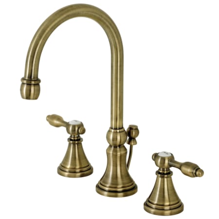Kingston Brass Tudor 1.2 GPM Deck Mounted Widespread Bathroom Faucet with Pop-Up Drain Assembly Antique Brass
