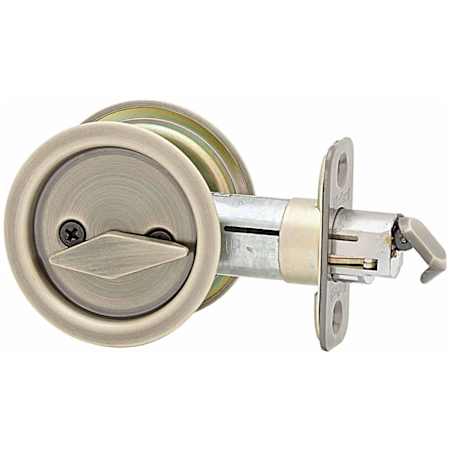 Kwikset Round Privacy Bed/Bath Pocket Door Lock Antique Brass