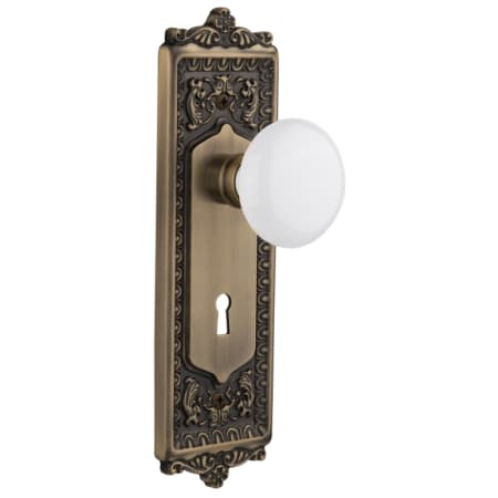 Nostalgic Warehouse White Porcelain Solid Brass Passage Door Knob Set with Egg and Dart Rose, Keyhole and 2-3/8" Backset Antique Brass