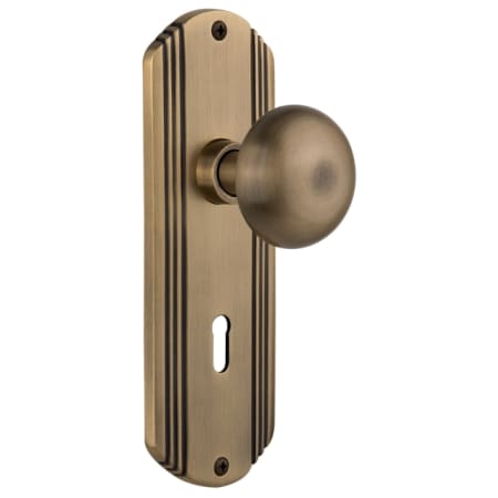 Nostalgic Warehouse New York Solid Brass Passage Door Knob Set with Deco Rose, Keyhole and 2-3/8" Backset Antique Brass