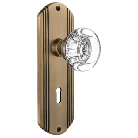 Nostalgic Warehouse Round Clear Crystal Passage Door Knob Set with Solid Brass Art Deco Back Plate, Keyhole and 2-3/8" Backset Antique Brass