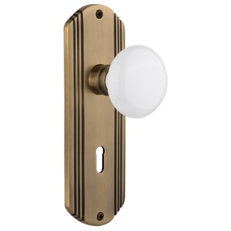 Nostalgic Warehouse Vintage White Porcelain Vintage Skeleton Key Retrofit Entry Handleset Trim with Brass Art Deco Plate, Keyhole and 2-1/4" Backset Antique Brass