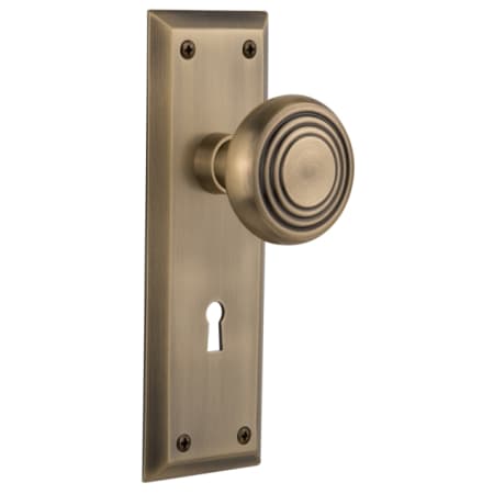 Nostalgic Warehouse Deco Solid Brass Privacy Door Knob Set with New York Rose, Keyhole and 2-3/8" Backset Antique Brass