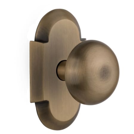 Nostalgic Warehouse New York Solid Brass Passage Door Knob Set with Cottage Rose and 2-3/4" Backset Antique Brass