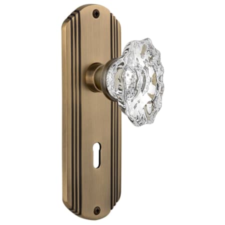 Nostalgic Warehouse Vintage Chateau Fluted Crystal Passage Door Knob Set with Solid Brass Art Deco Plate, Keyhole and 2-3/4" Backset Antique Brass
