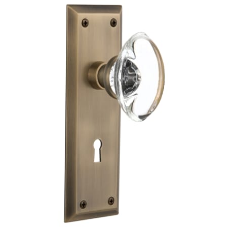 Nostalgic Warehouse Oval Clear Crystal Solid Brass Privacy Door Knob Set with New York Rose, Keyhole and 2-3/8" Backset Antique Brass