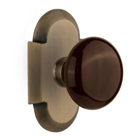 Nostalgic Warehouse Brown Porcelain Solid Brass Single Dummy Door Knob with Cottage Style Plate Antique Brass