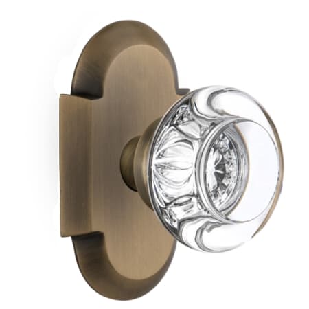 Nostalgic Warehouse Round Clear Crystal Solid Brass Privacy Door Knob Set with Cottage Style Plate and 2-3/4" Backset Antique Brass