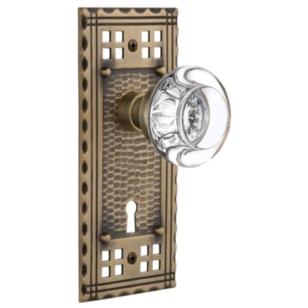 Nostalgic Warehouse Round Clear Crystal Solid Brass Single Dummy Door Knob with Long Craftsman Plate and Keyhole Antique Brass