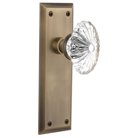 Nostalgic Warehouse Oval Fluted Crystal Solid Brass Privacy Door Knob Set with New York Rose and 2-3/4" Backset Antique Brass
