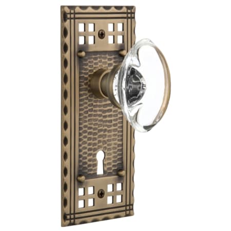 Nostalgic Warehouse Vintage Oval Clear Crystal  Privacy Door Knob Set with Solid Brass Long Craftsman Plate, Keyhole and 2-3/4" Backset Antique Brass