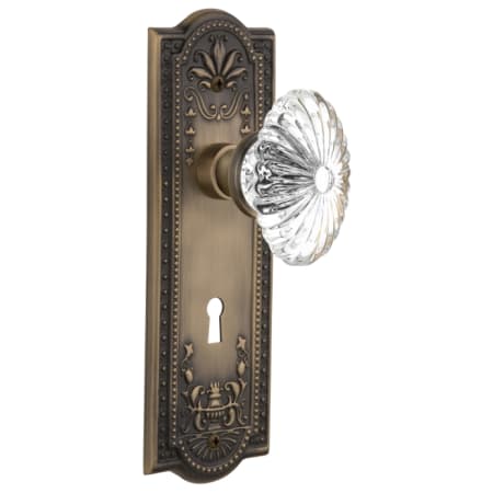 Nostalgic Warehouse Vintage Fluted Crystal Flower Privacy Door Knob Set with Solid Brass Meadows Rose, Keyhole and 2-3/4" Backset Antique Brass