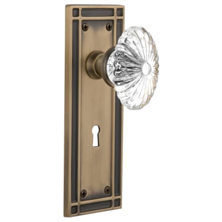 Nostalgic Warehouse Oval Fluted Crystal Solid Brass Privacy Door Knob Set with Mission Rose, Keyhole and 2-3/4" Backset Antique Brass