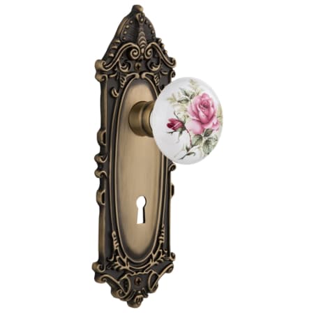 Nostalgic Warehouse Rose Porcelain Solid Brass Privacy Door Knob Set with Victorian Rose, Keyhole and 2-3/4" Backset Antique Brass