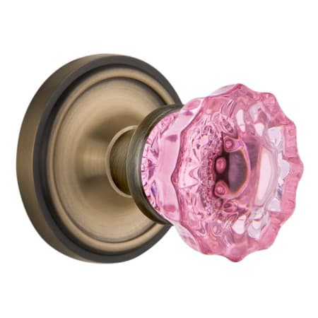 Nostalgic Warehouse Classic Solid Brass Rose Passage Door Knob Set with Pink Crystal Knob and 2-3/8" Backset Antique Brass