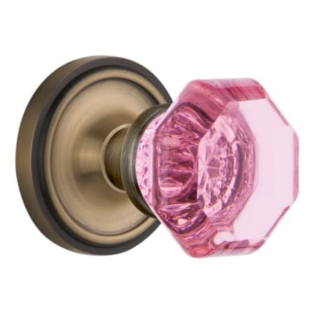 Nostalgic Warehouse Classic Solid Brass Rose Passage Door Knob Set with Pink Waldorf Knob and 2-3/4" Backset Antique Brass