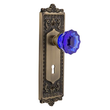 Nostalgic Warehouse Egg and Dart Solid Brass Rose Passage Door Knob Set with Cobalt Crystal Knob and Decorative Keyhole for 2-3/8" Backset Antique Brass