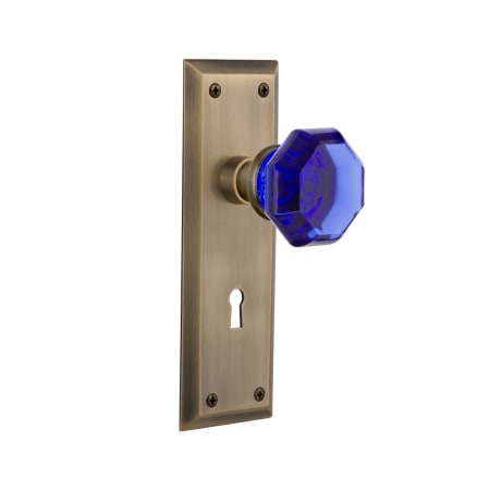 Nostalgic Warehouse New York Solid Brass Rose Passage Door Knob Set with Cobalt Waldorf Knob and Decorative Keyhole for 2-3/4" Backset Antique Brass