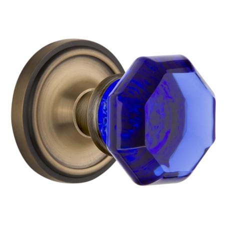 Nostalgic Warehouse Classic Solid Brass Rose Privacy Door Knob Set with Cobalt Waldorf Knob and 2-3/8" Backset Antique Brass