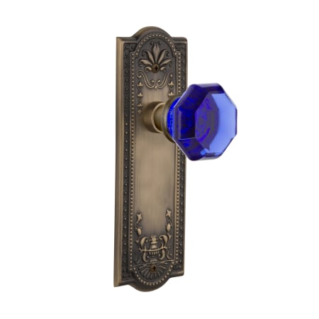 Nostalgic Warehouse Meadows Solid Brass Rose Privacy Door Knob Set with Cobalt Waldorf Door Knob and 2-3/4" Backset Antique Brass