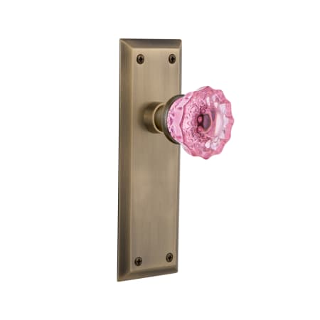 Nostalgic Warehouse New York Solid Brass Rose Privacy Door Knob Set with Pink Crystal Knob for 2-3/8" Backset Antique Brass