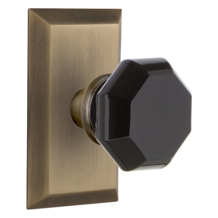 Nostalgic Warehouse Studio Solid Brass Rose Privacy Door Knob Set with Black Waldorf Knob and 2-3/8" Backset Antique Brass