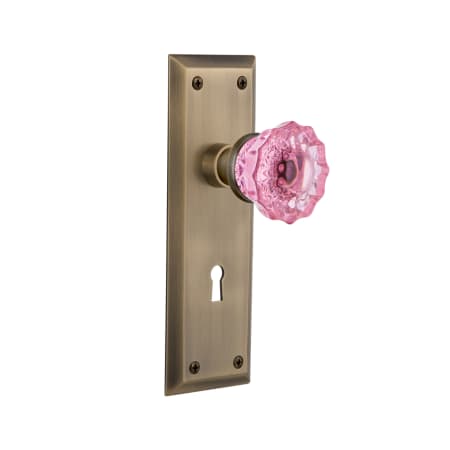 Nostalgic Warehouse New York Solid Brass Rose Privacy Door Knob Set with Pink Crystal Knob and Decorative Keyhole for 2-3/8" Backset Antique Brass