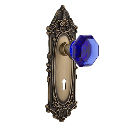 Nostalgic Warehouse Victorian Rose Privacy Door Knob Set with Cobalt Waldorf Knob and Decorative Skeleton Keyhole for 2-3/8" Backset Antique Brass