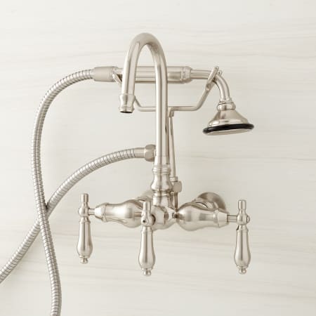 Signature Hardware Pasaia Wall Mounted Clawfoot Tub Filler with Built-In Diverter and 4 Inch Wall Couplers - Includes Hand Shower Brushed Nickel