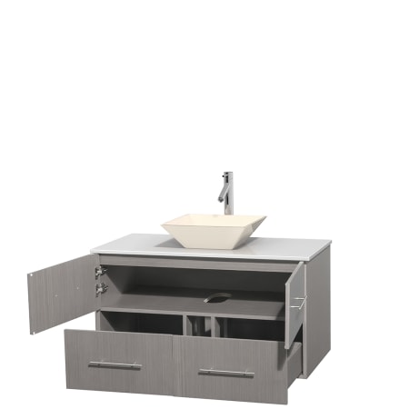 Open Vanity View with White Stone Top and Vessel Sink