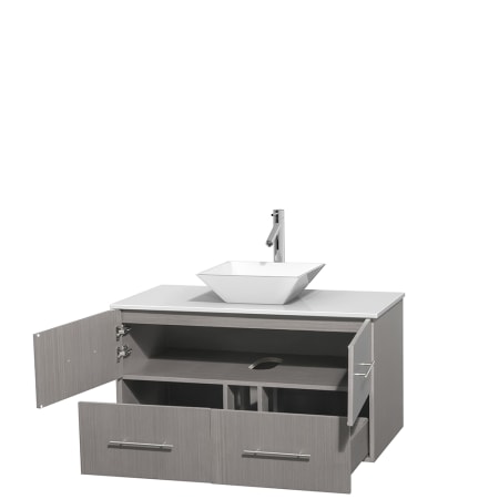 Open Vanity View with White Stone Top and Vessel Sink